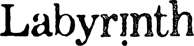 Intricate stone labyrinth with winding paths and high walls, surrounded by greenery.