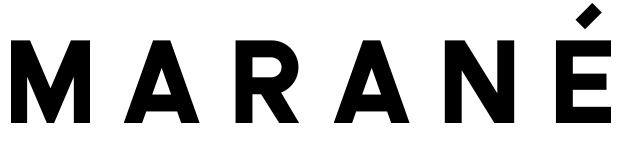 A vibrant marane fish with distinctive patterns swimming in clear blue water.